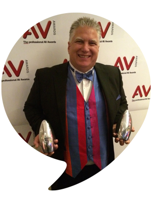 Steve Helliker holding awards